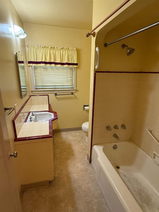 2314 E Cornell Ave, Fresno, CA 93703 - full bathroom with toilet, vanity, bathing tub / shower combination, baseboards, and tile patterned floors