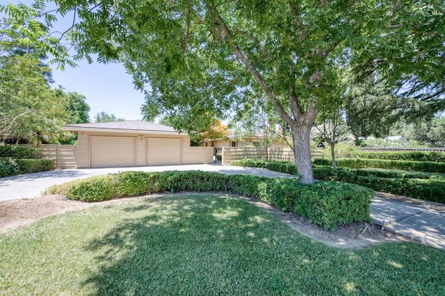 1463 W Browning Ave, Fresno, CA 93711 - view of yard with concrete driveway and an attached garage
