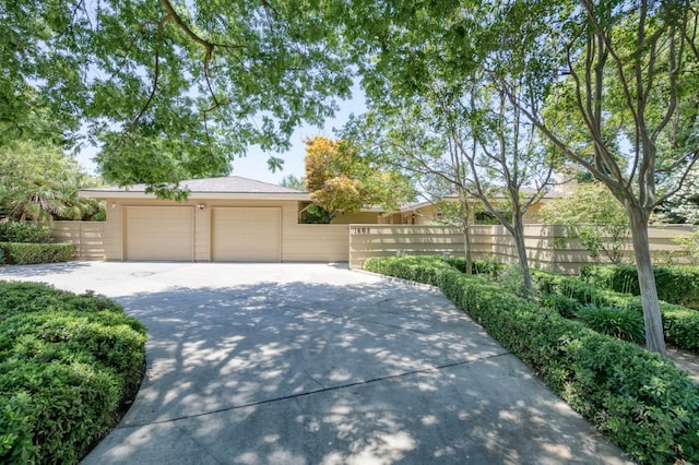 1463 W Browning Ave, Fresno, CA 93711 - view of front of home featuring driveway and a garage