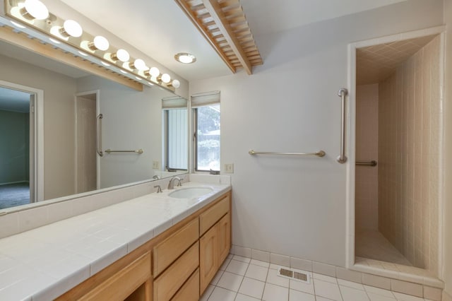 1463 W Browning Ave, Fresno, CA 93711 - full bath with vanity, tiled shower, and tile patterned floors