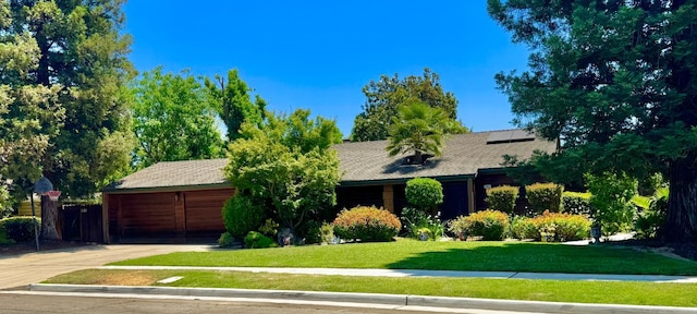 8866 N Ione Ave, Fresno, CA 93720 - view of front of home with solar panels and a front yard