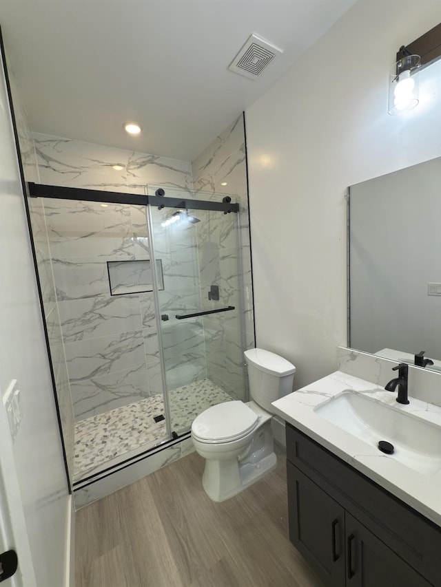 21275 Rd 28 Unit 1 2, Madera, CA 93638 - full bath featuring toilet, vanity, a marble finish shower, wood finished floors, and recessed lighting