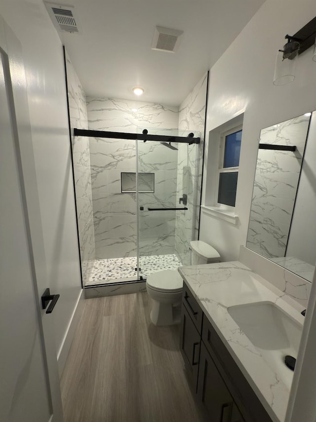21275 Rd 28 Unit 1 2, Madera, CA 93638 - full bath with toilet, vanity, a marble finish shower, and wood finished floors