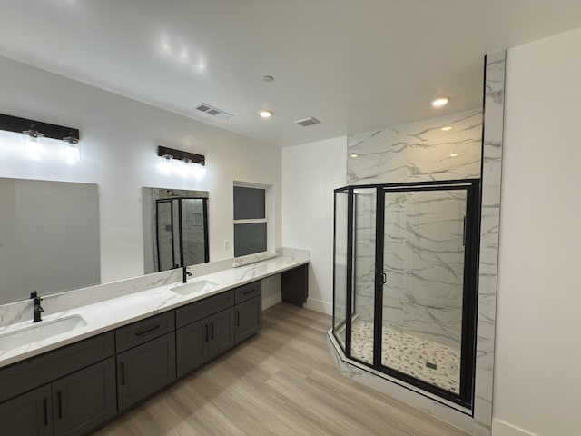 21275 Rd 28 Unit 1 2, Madera, CA 93638 - full bathroom featuring a marble finish shower, wood finished floors, double vanity, baseboards, and recessed lighting