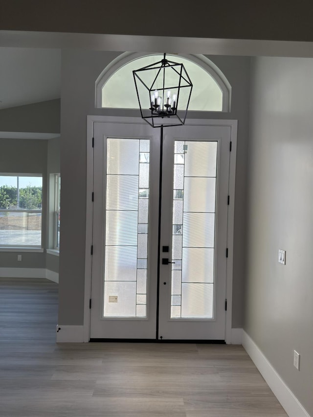 21275 Rd 28 Unit 1 2, Madera, CA 93638 - doorway to outside with light wood-type flooring, baseboards, a chandelier, and french doors