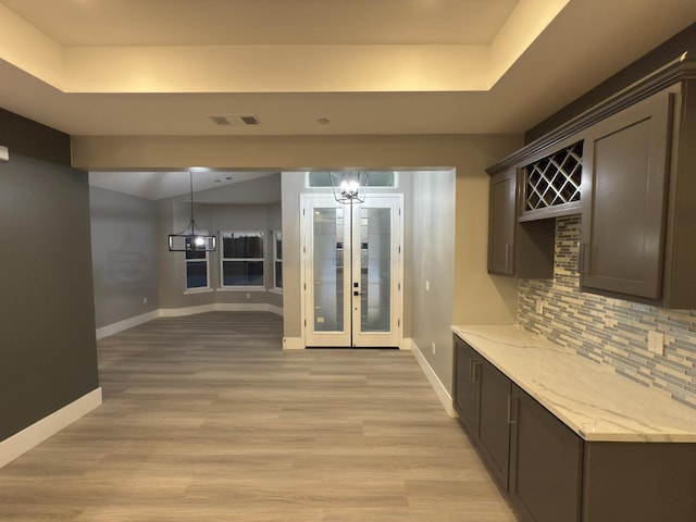 21275 Rd 28 Unit 1 2, Madera, CA 93638 - interior space with baseboards, a chandelier, a raised ceiling, and light wood-type flooring