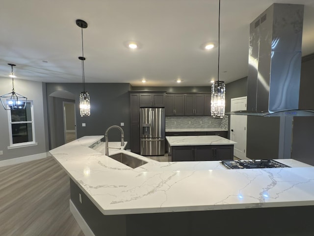 21275 Rd 28 Unit 1 2, Madera, CA 93638 - kitchen with appliances with stainless steel finishes, a sink, an island with sink, range hood, and wood finished floors