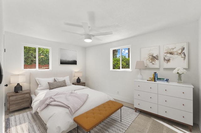 2543 E Ashcroft Ave, Fresno, CA 93726 - bedroom with baseboards, a ceiling fan, and light carpet