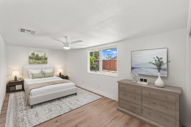 2543 E Ashcroft Ave, Fresno, CA 93726 - bedroom with light wood-style flooring, baseboards, and ceiling fan