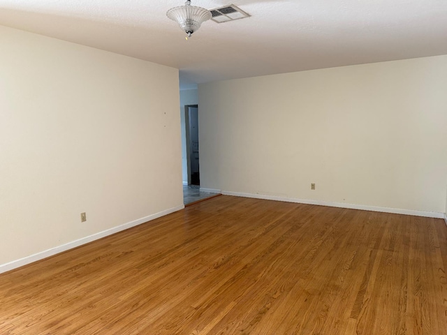 336 Walnut Ave, Coalinga, CA 93210 - empty room with light wood-style flooring and baseboards