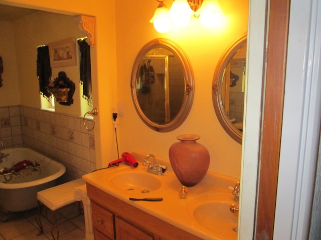2725 E Normal Ave, Fresno, CA 93703 - bathroom with a freestanding bath, double vanity, a chandelier, and tile patterned floors