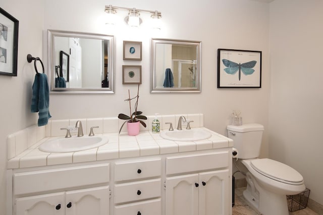 36140 Blanca Ave, Madera, CA 93636 - bathroom featuring double vanity, toilet, and a shower