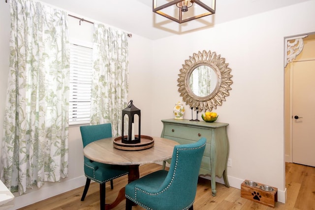 36140 Blanca Ave, Madera, CA 93636 - dining room with a chandelier, light wood-style flooring, and baseboards