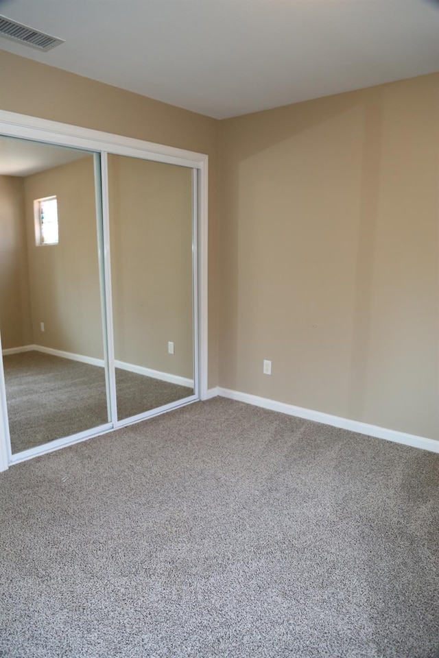 5811 W Cromwell Ave, Fresno, CA 93722 - unfurnished bedroom featuring carpet floors, baseboards, and a closet