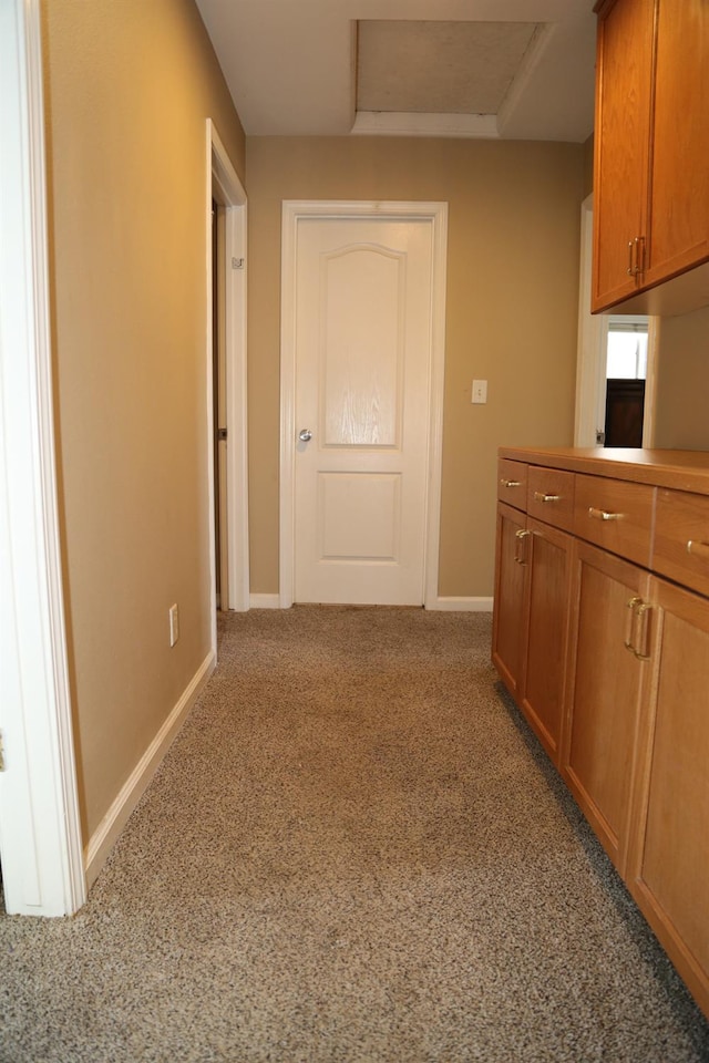5811 W Cromwell Ave, Fresno, CA 93722 - hall featuring attic access, baseboards, and light carpet