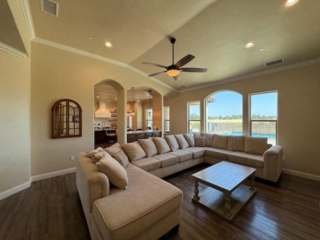 13390 E Falcon Mdw, Clovis, CA 93619 - living room with baseboards, wood finished floors, arched walkways, a ceiling fan, and ornamental molding