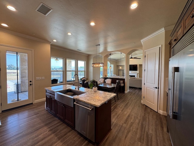 13390 E Falcon Mdw, Clovis, CA 93619 - kitchen featuring a sink, appliances with stainless steel finishes, baseboards, dark wood-style flooring, and crown molding
