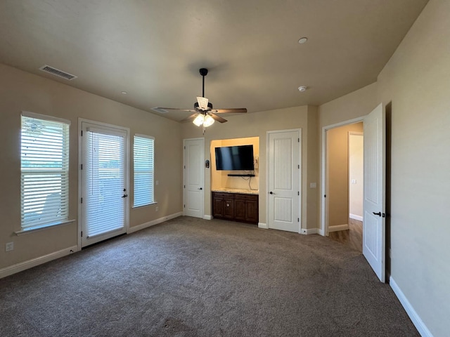 13390 E Falcon Mdw, Clovis, CA 93619 - unfurnished living room with carpet, baseboards, and a ceiling fan