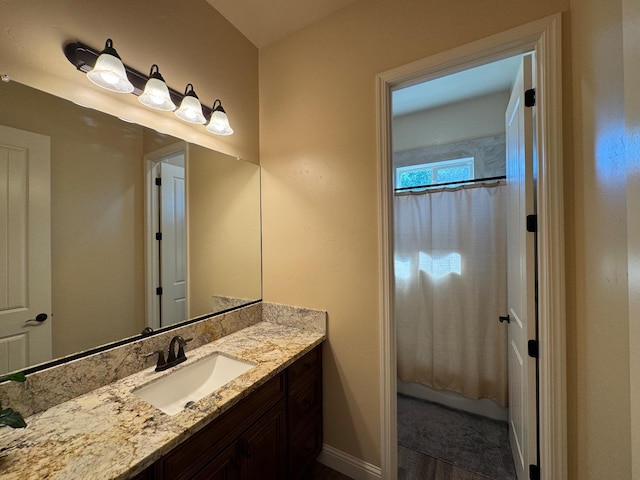 13390 E Falcon Mdw, Clovis, CA 93619 - bathroom featuring vanity, a shower with shower curtain, and baseboards