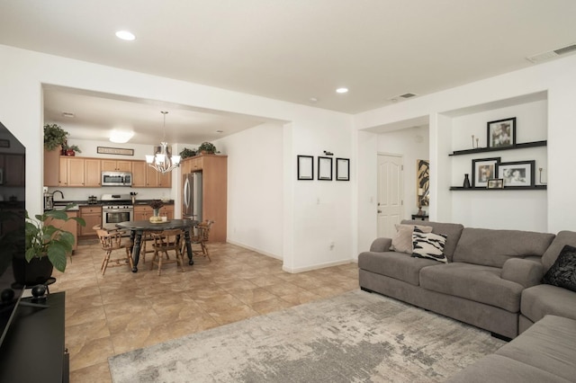 7452 E Giavanna Ave, Fresno, CA 93737 - living area with a chandelier, recessed lighting, and baseboards