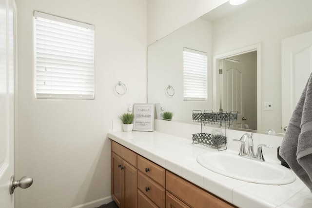 7452 E Giavanna Ave, Fresno, CA 93737 - bathroom featuring vanity and baseboards
