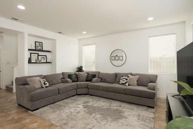 7452 E Giavanna Ave, Fresno, CA 93737 - tiled living area with recessed lighting and stairs