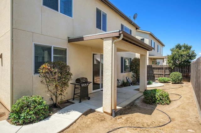 7452 E Giavanna Ave, Fresno, CA 93737 - rear view of property with stucco siding and a patio area