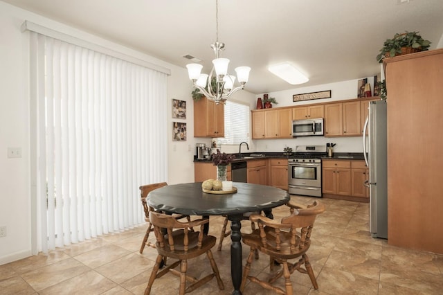 7452 E Giavanna Ave, Fresno, CA 93737 - dining room with a chandelier