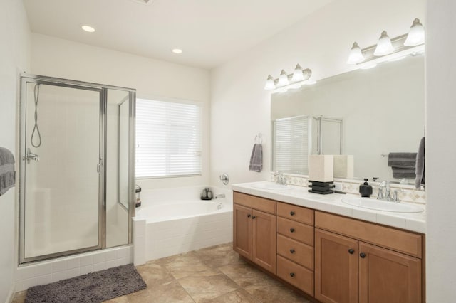 7452 E Giavanna Ave, Fresno, CA 93737 - bathroom with double vanity, a garden tub, a stall shower, and recessed lighting