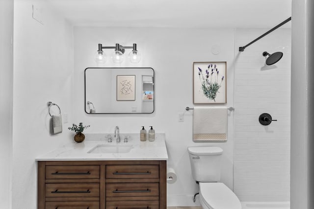 3926 N Kavanagh Ave, Fresno, CA 93705 - full bathroom with toilet, vanity, and tiled shower