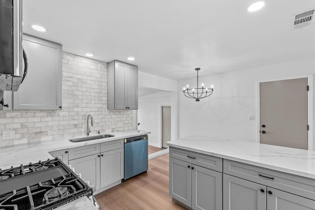 3926 N Kavanagh Ave, Fresno, CA 93705 - kitchen featuring dishwashing machine, a sink, gray cabinetry, gas range, and light stone counters