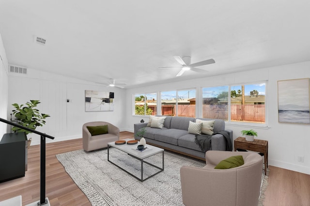 3926 N Kavanagh Ave, Fresno, CA 93705 - living area featuring a ceiling fan, light wood-style floors, and baseboards