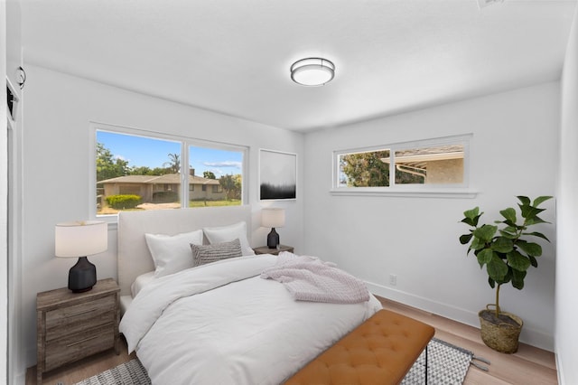 3926 N Kavanagh Ave, Fresno, CA 93705 - bedroom with wood finished floors and baseboards