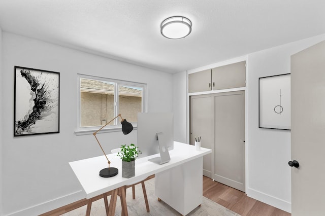 3926 N Kavanagh Ave, Fresno, CA 93705 - home office with light wood-style floors and baseboards