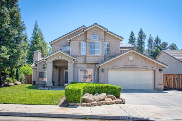 1039 N Burgan Ave, Clovis, CA 93611 - traditional-style home featuring concrete driveway, a chimney, an attached garage, and stucco siding