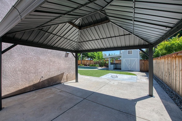 1039 N Burgan Ave, Clovis, CA 93611 - view of car parking featuring a storage shed, a fenced backyard, and a gazebo