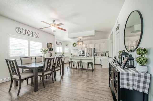 1039 N Burgan Ave, Clovis, CA 93611 - dining space featuring light wood-style flooring and ceiling fan