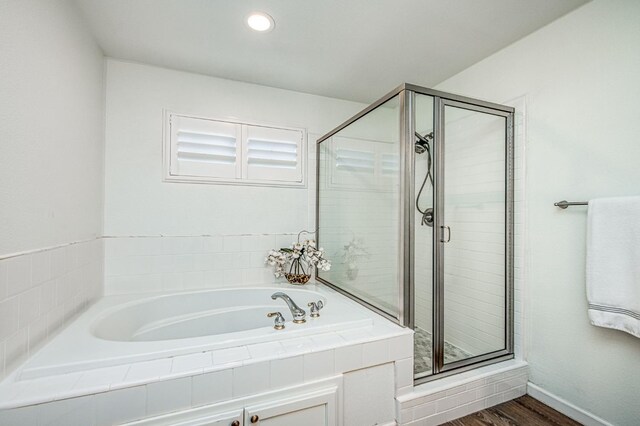 1039 N Burgan Ave, Clovis, CA 93611 - full bath with a bath, a stall shower, baseboards, wood finished floors, and recessed lighting