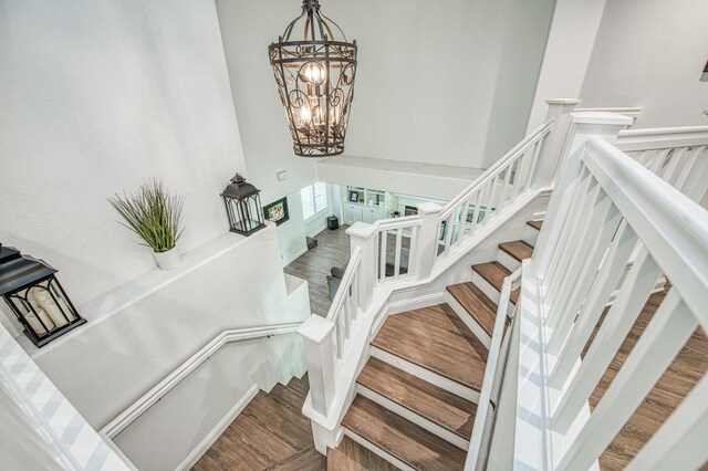1039 N Burgan Ave, Clovis, CA 93611 - stairs with a chandelier and wood finished floors