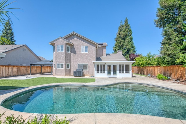 1039 N Burgan Ave, Clovis, CA 93611 - view of pool featuring french doors, a patio area, central AC unit, a gazebo, and a sunroom