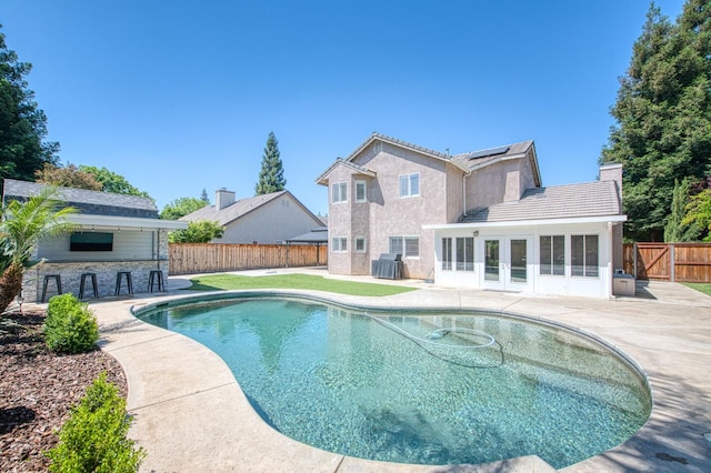 1039 N Burgan Ave, Clovis, CA 93611 - view of pool with a fenced backyard, a patio area, and french doors