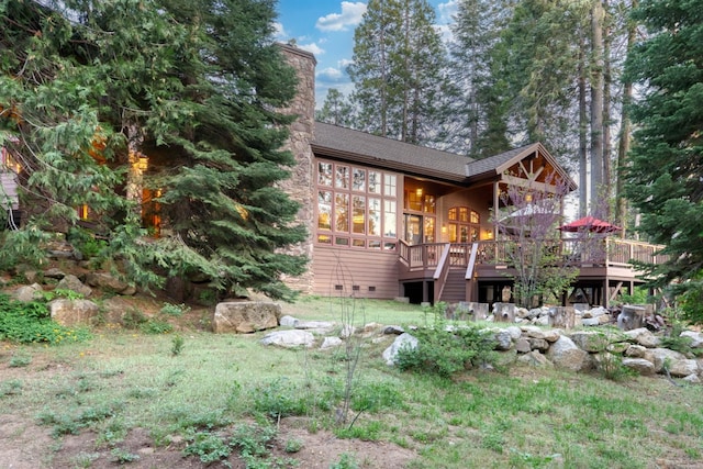 39516 Littleridge Rd, Shaver Lake, CA 93664 - view of front of property with a wooden deck, a chimney, and a shingled roof