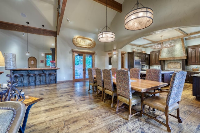 39516 Littleridge Rd, Shaver Lake, CA 93664 - dining room with beam ceiling, wood finished floors, arched walkways, a chandelier, and high vaulted ceiling