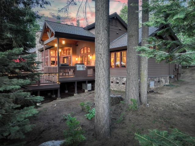 39516 Littleridge Rd, Shaver Lake, CA 93664 - back of property at dusk with a deck and roof with shingles