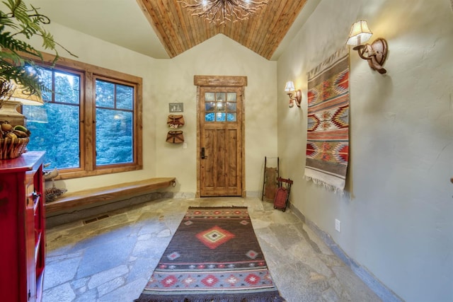 39516 Littleridge Rd, Shaver Lake, CA 93664 - entrance foyer featuring stone tile flooring, wooden ceiling, and vaulted ceiling
