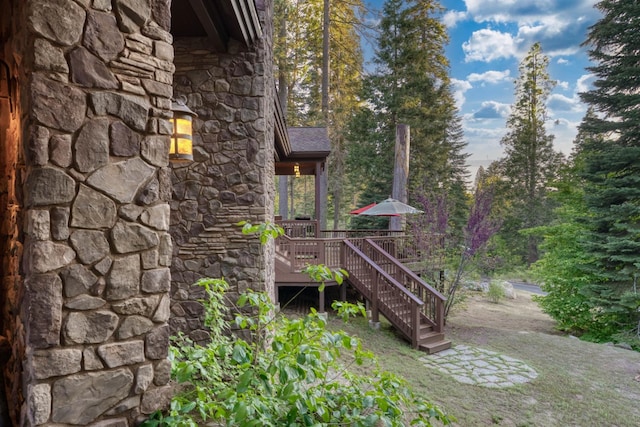 39516 Littleridge Rd, Shaver Lake, CA 93664 - view of home's exterior with stone siding, a deck, and stairway