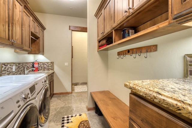 39516 Littleridge Rd, Shaver Lake, CA 93664 - laundry area with cabinet space, independent washer and dryer, baseboards, and light stone finish flooring