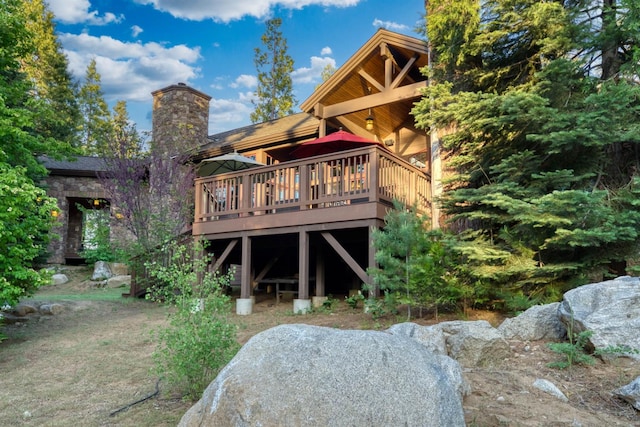 39516 Littleridge Rd, Shaver Lake, CA 93664 - back of house with a deck and a chimney