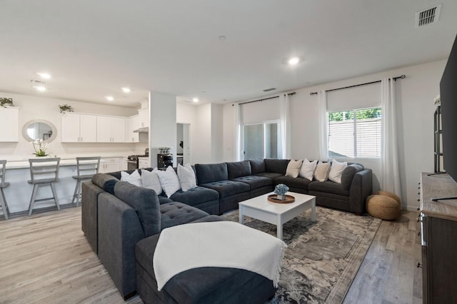 987 S Filbert Ave, Fresno, CA 93727 - living area with light wood-style flooring and recessed lighting
