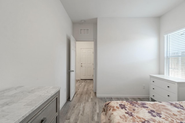 987 S Filbert Ave, Fresno, CA 93727 - bedroom featuring light wood-style flooring and baseboards